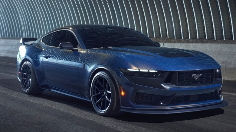 Ford Mustang Dark Horse parked in a tunnel