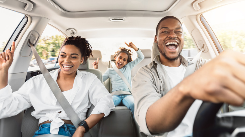 family singing in car