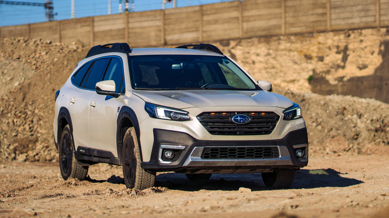 Subaru Outback parked on dirt