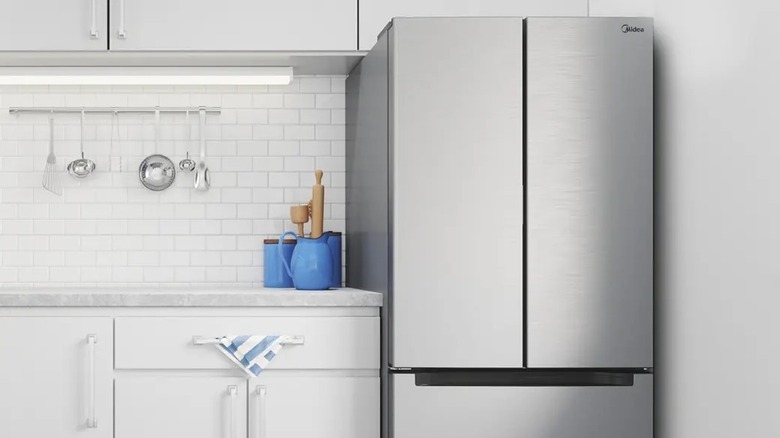 Midea MFR18B4AST installed in the kitchen with white theme