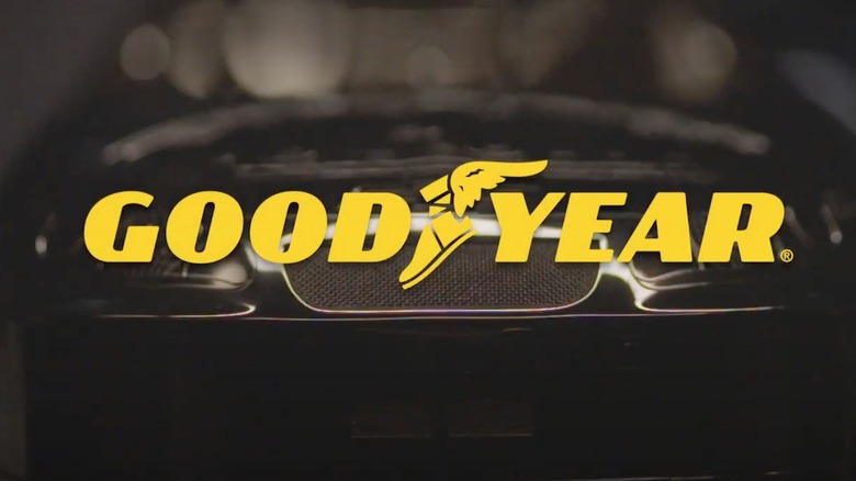 Goodyear Tires logo with vehicle in the background