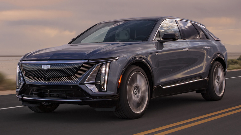 Cadillac Lyriq driving at sunset