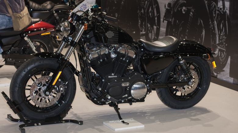 A Harley-Davidson Forty-Eight Sportster finished in black at an international bike show