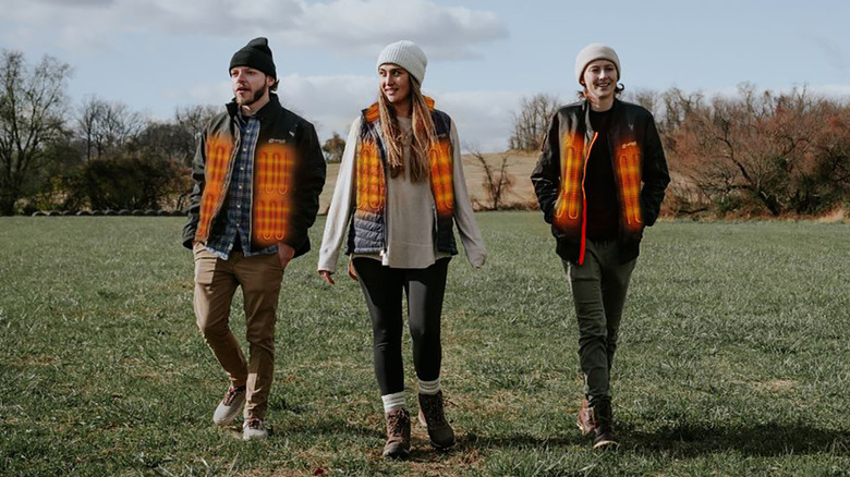 A shot of three Venture Heat heated jackets being worn