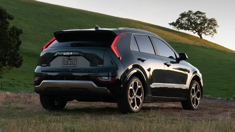 Black 2023 Kia Niro on dirt road