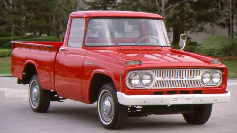 Red 1965 Toyota Stout compact pickup truck front 3/4 view