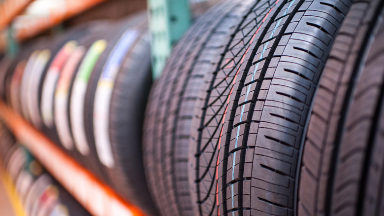 Shallow-focus image of new tires on a tire rack