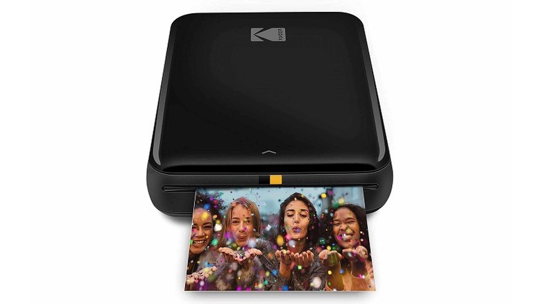 A black KODAK Step printing a photo of four women