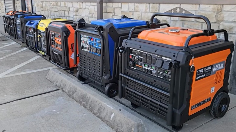 A row of portable generators outside a store, on a sidewalk