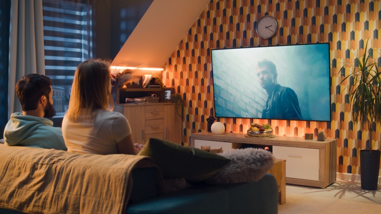 couple watching TV at home