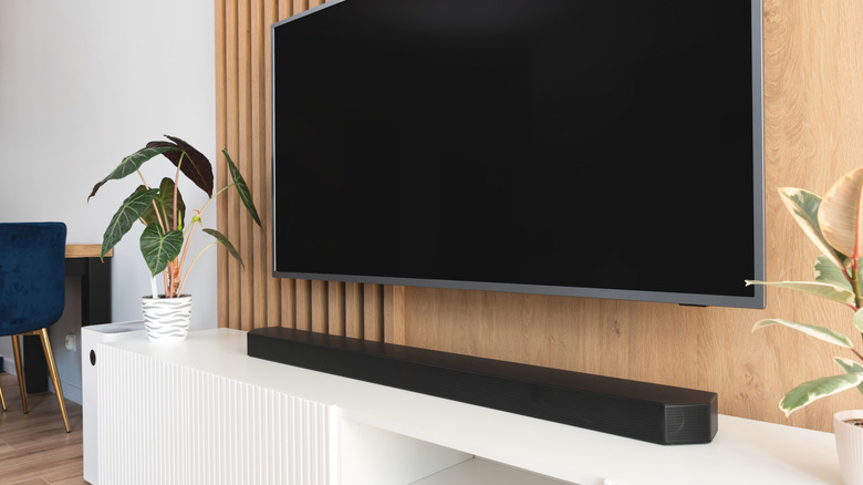 soundbar set up on a stand below tv