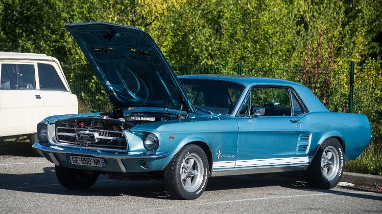 Blue 1967 Mustang with the engine bay open