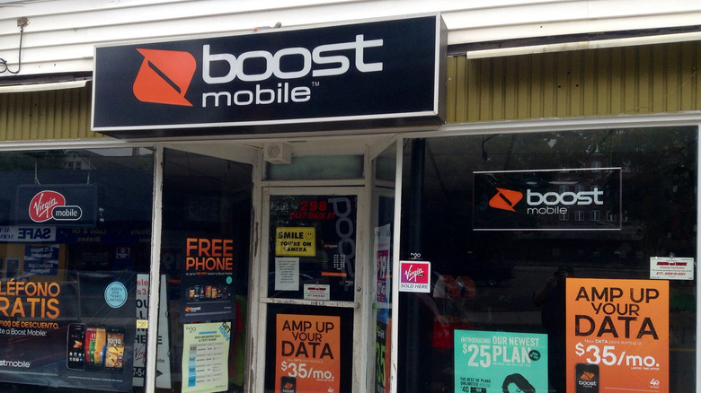 A small Boost Mobile store in a strip mall