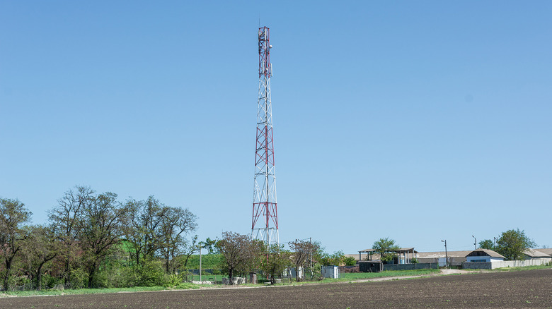 A cell phone tower against a blue sky