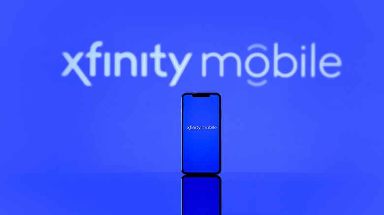 An Xfinity Mobile logo with a smartphone in the foreground, also displaying the Xfinity logo