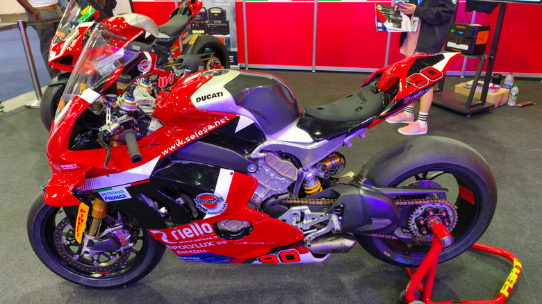 Ducati Panigale V4 R on wheel stand in pit area