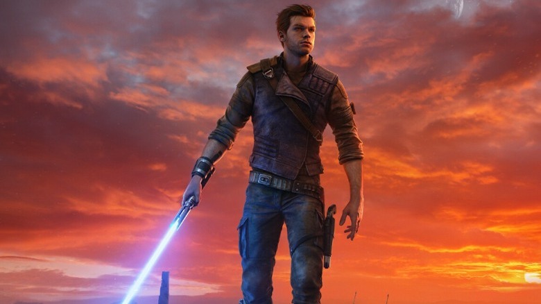 Cal standing with his blue lightsaber