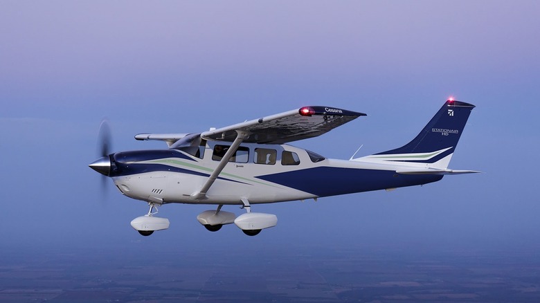 Left-side view of Cessna 206 Stationair flying at altitude