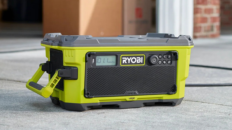 Ryobi One+ 18V Hybrid Verse Link Stereo on a driveway