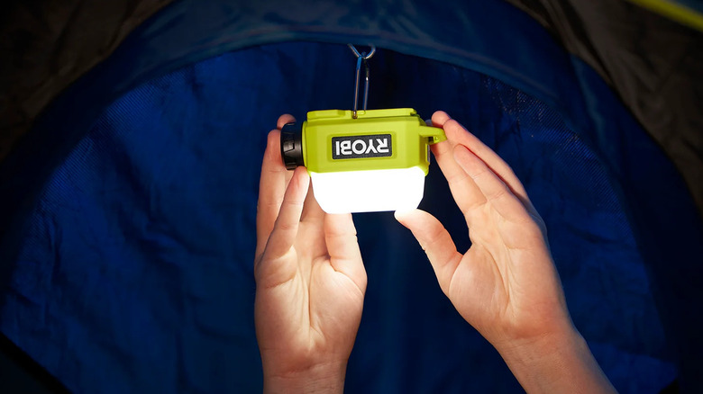 Ryobi USB Lithium Area Light hung inside a tent