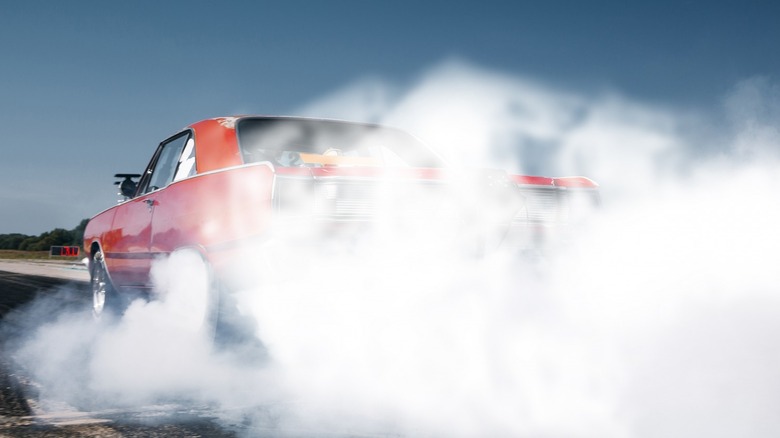 Car performing a smokey tire burnout