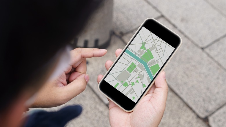 Person using navigation app smartphone