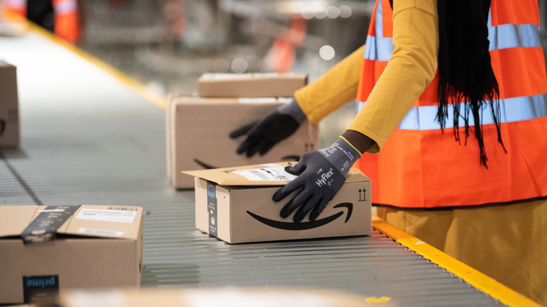Amazon employee sorting packages