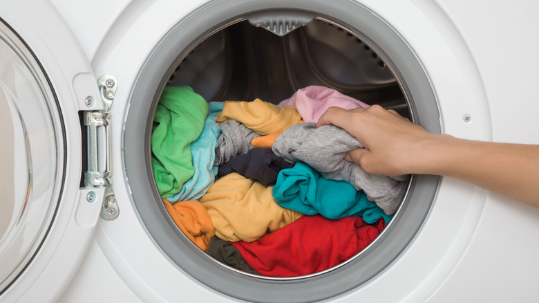 A white front-load washing machine with a full drum