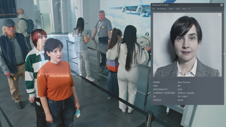 Security checkpoint with people passing through biometric facial scanning showing person's face