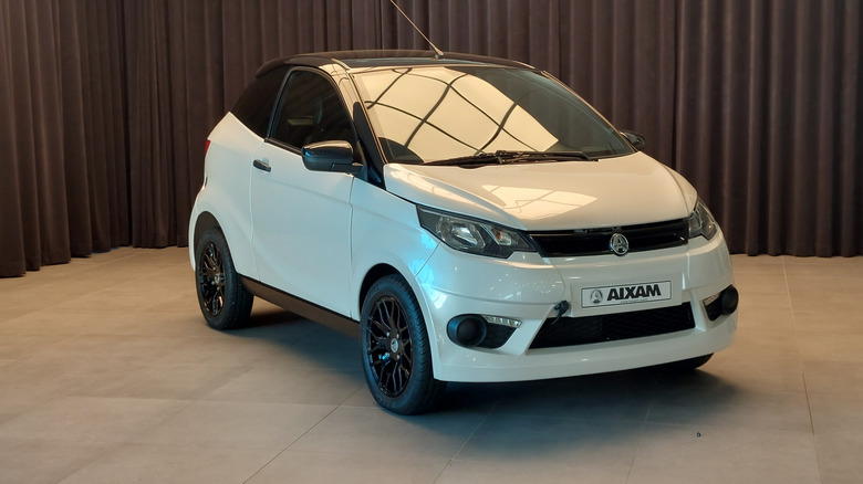 An Aixam microcar in white, front 3/4 view