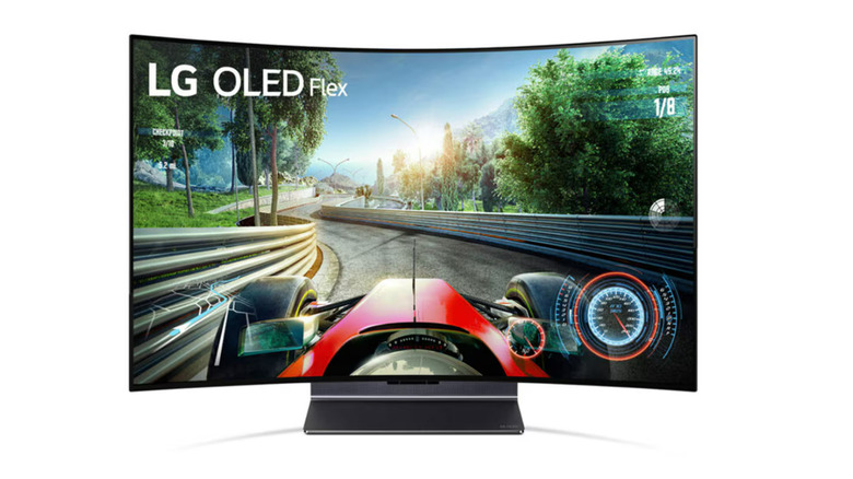 An LG OLED Flex TV screen shown from the front with a racing game on it.