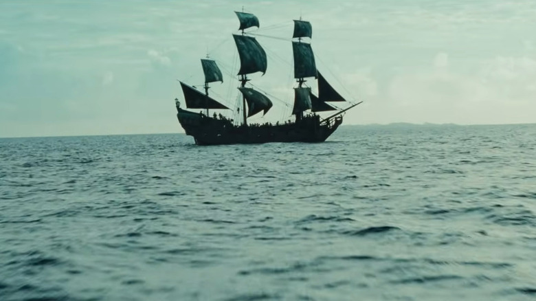 The Black Pearl on the water with its sails down