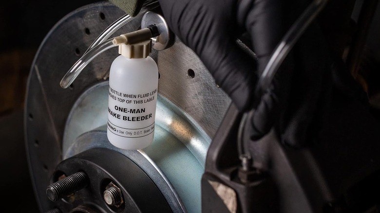 The One-Man Brake Bleeder gravity system being used to bleed brake lines