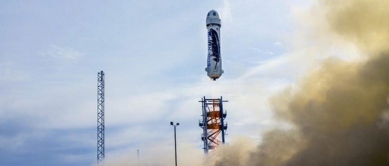 Blue Origin first to successfully land reusable rocket, beating SpaceX