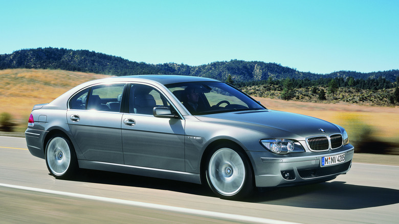 2006 BMW 760 li equipped with N73 V12 driving on open road, right-front 3/4 view