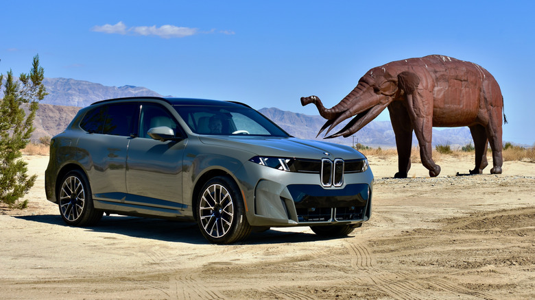 2027 BMW iX5 and a metal sculpture.