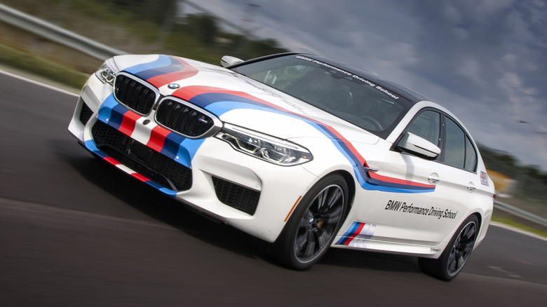 Front 3/4 view of BMW being driven on BMW Performance Center track