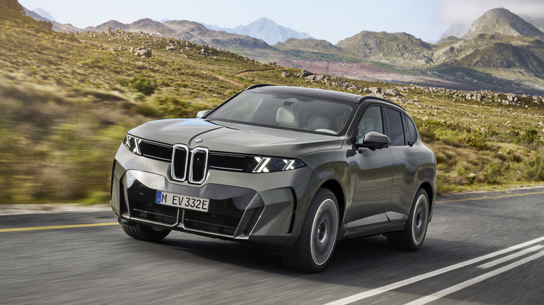 2027 BMW iX5 60 xDrive driving.