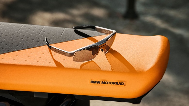 The BMW Motorrad ConnectedRide Smartglasses placed on a seat.