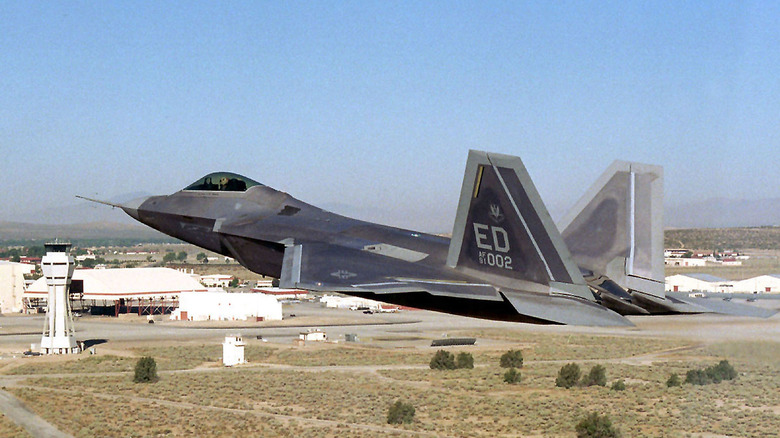 F-22 flying over air base