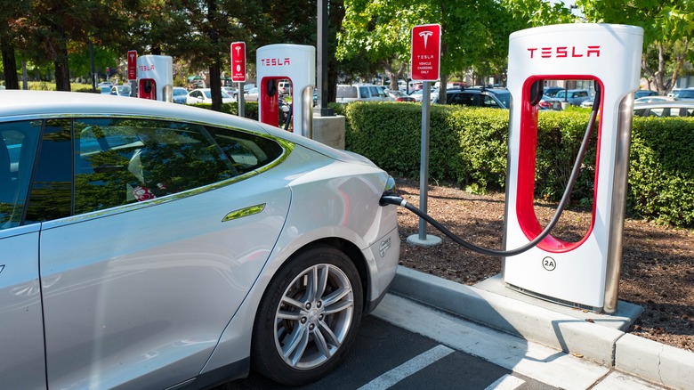 Tesla car plugged in charging