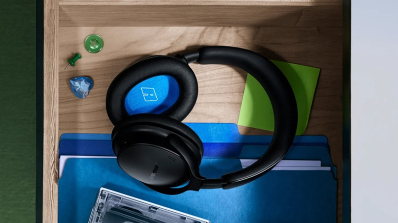 A black pair of Bose QuietComfort 2nd Gen headphones in a drawer.