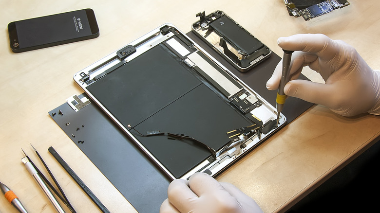 Image of an iPad's internal components in the middle of a repair