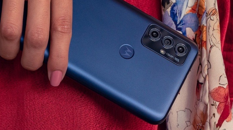 Woman holding Moto G Play