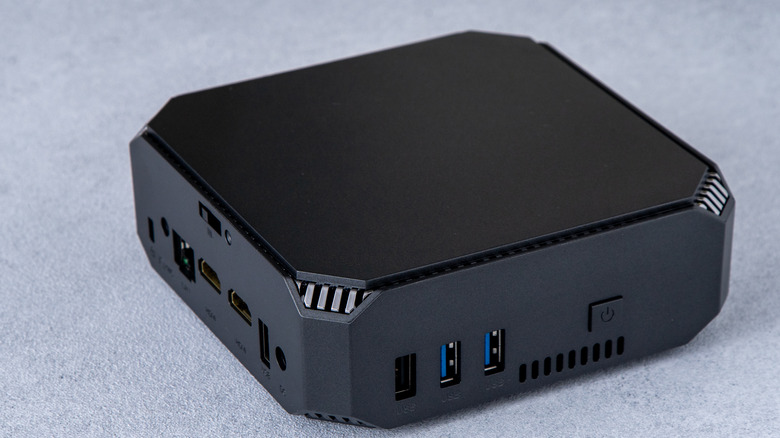 A mini PC on a grey background