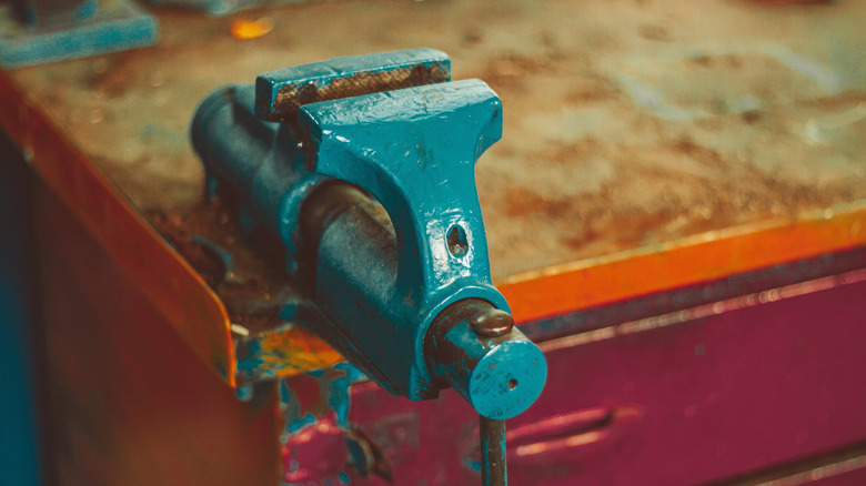 a bench vise on a work table
