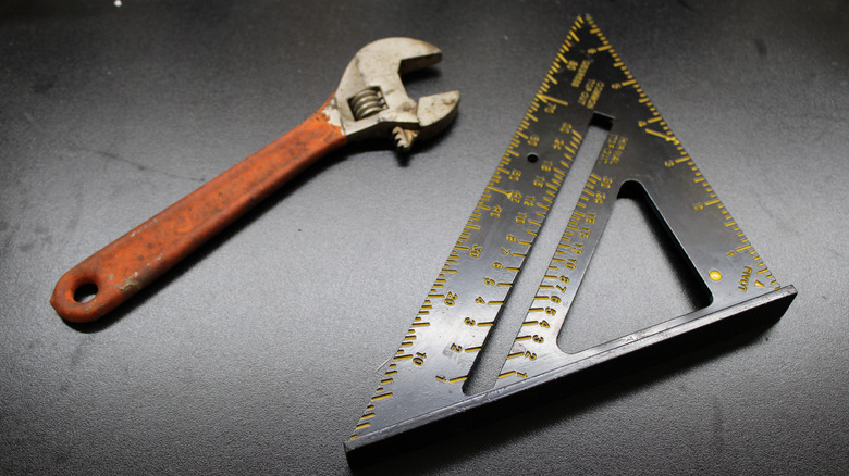 a speed square and wrench