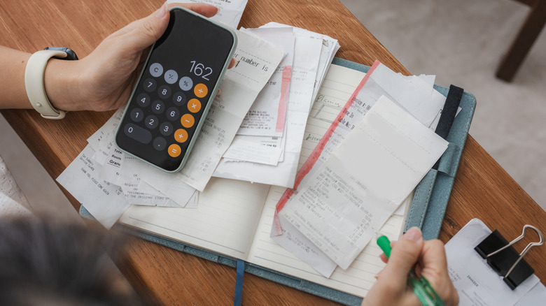 A person doing budgeting calculations