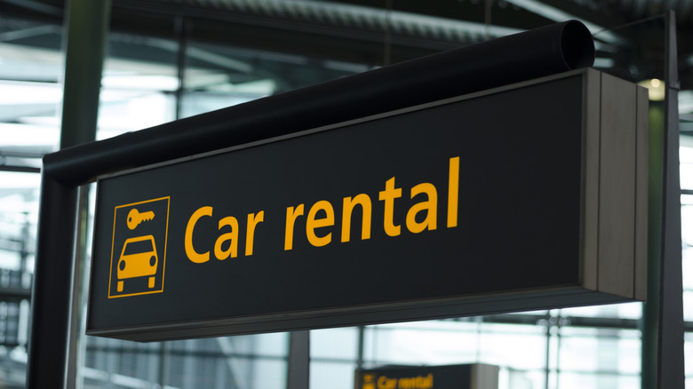 a car rental sign at an airport