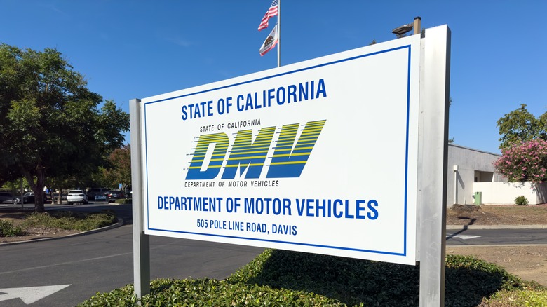 A white sign outside a California DMV location